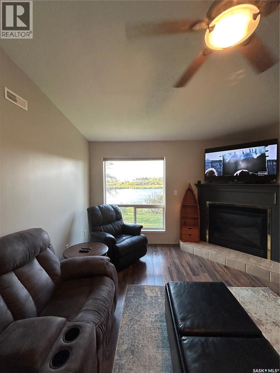 3830 First Point Beach Drive, Wakaw Lake, SK - Indoor Photo Showing Living Room With Fireplace