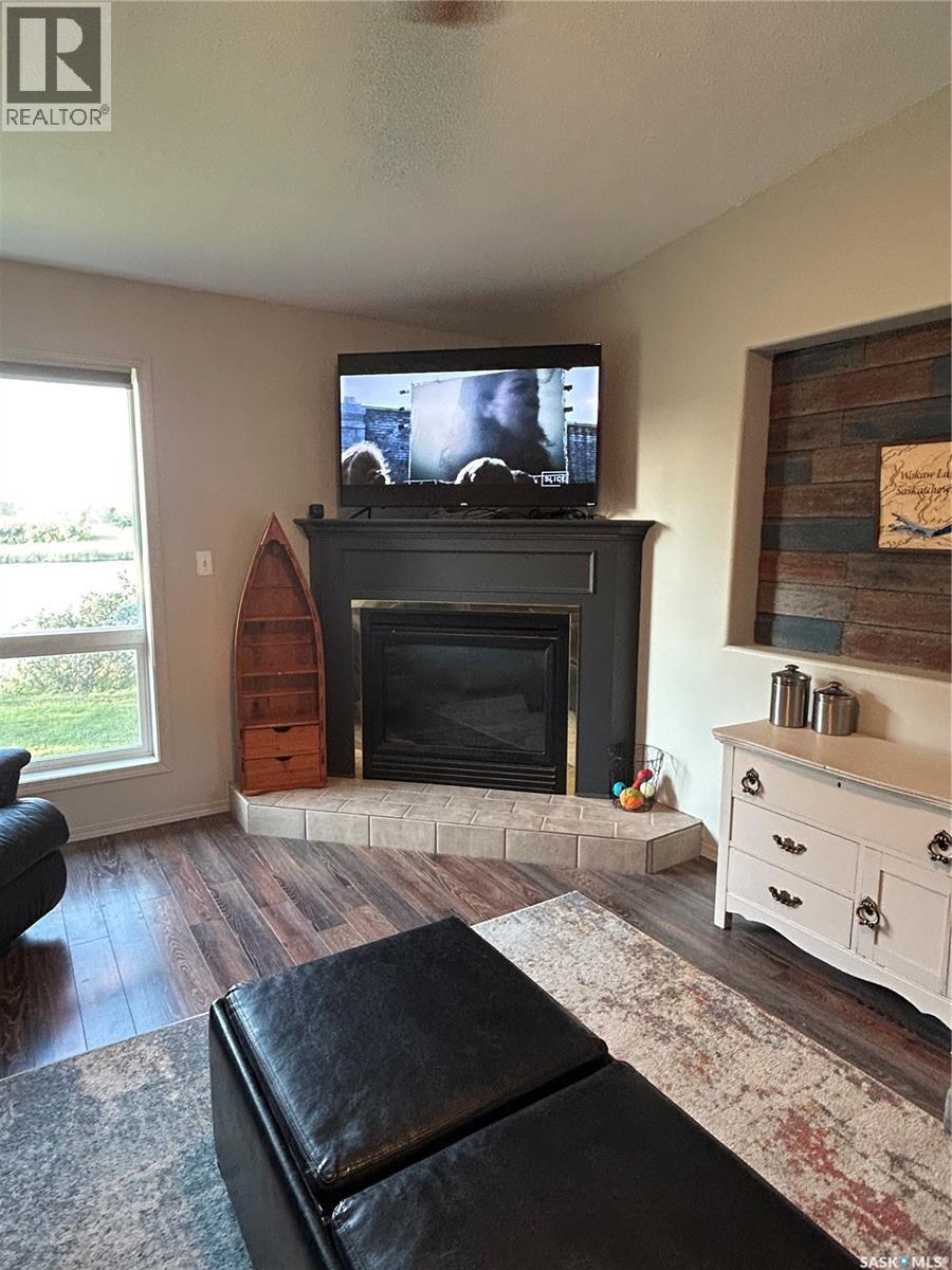 3830 First Point Beach Drive, Wakaw Lake, SK - Indoor Photo Showing Living Room With Fireplace