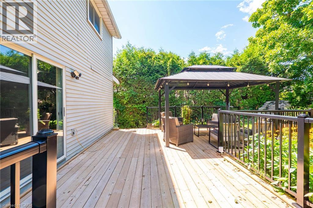 Expansive outdoor deck featuring wood flooring and black metal railings - 34 Peachtree Crescent, Cambridge, ON - Outdoor With Deck Patio Veranda