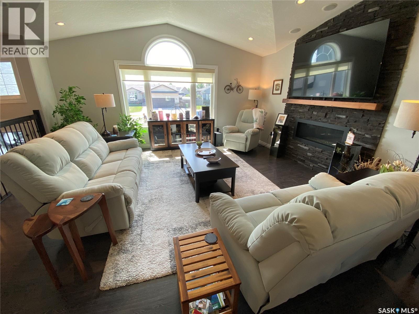 74 Madge Way, Yorkton, SK - Indoor Photo Showing Living Room With Fireplace