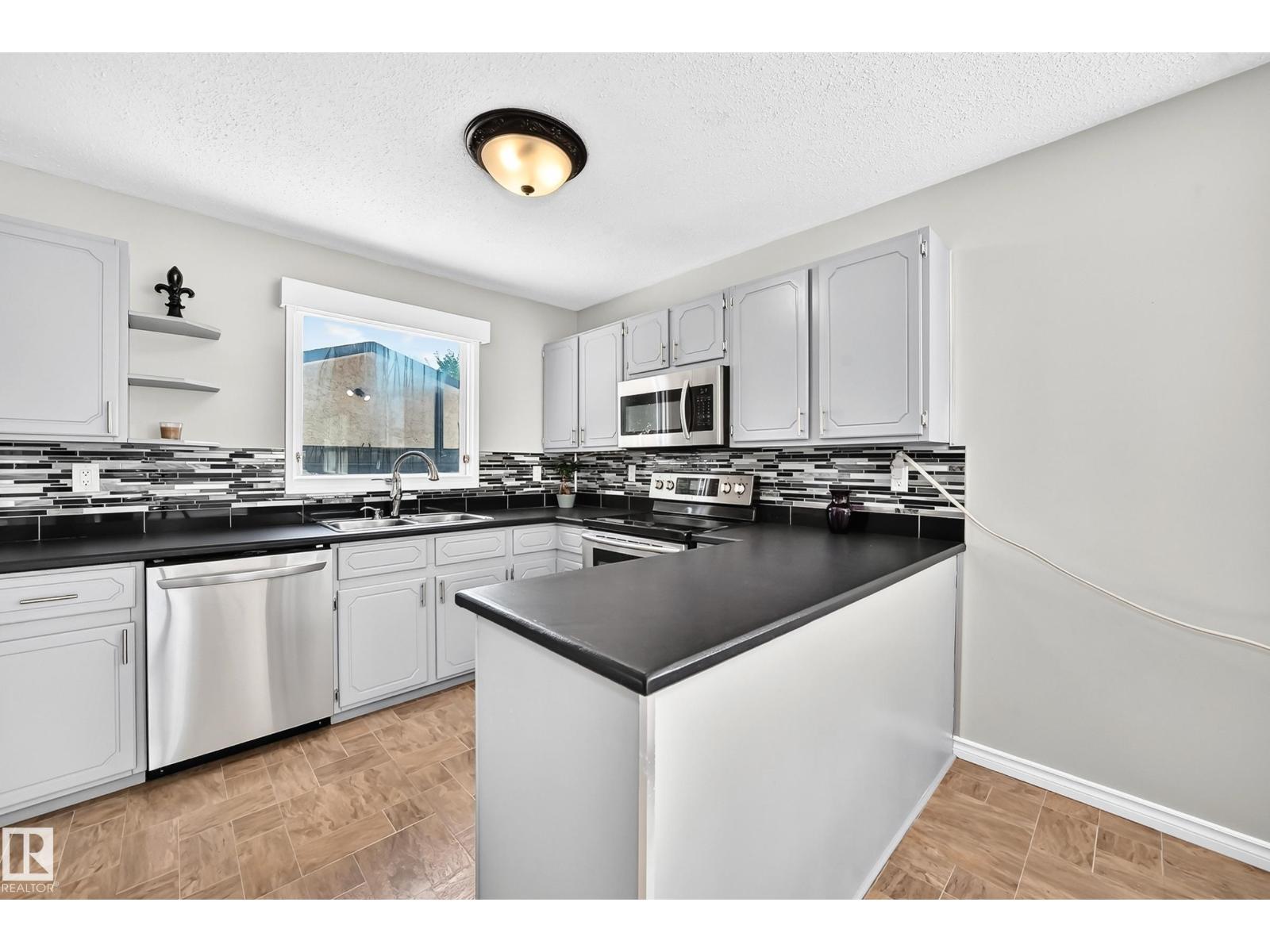 3615 10 Av Nw, Edmonton, AB - Indoor Photo Showing Kitchen With Double Sink With Upgraded Kitchen