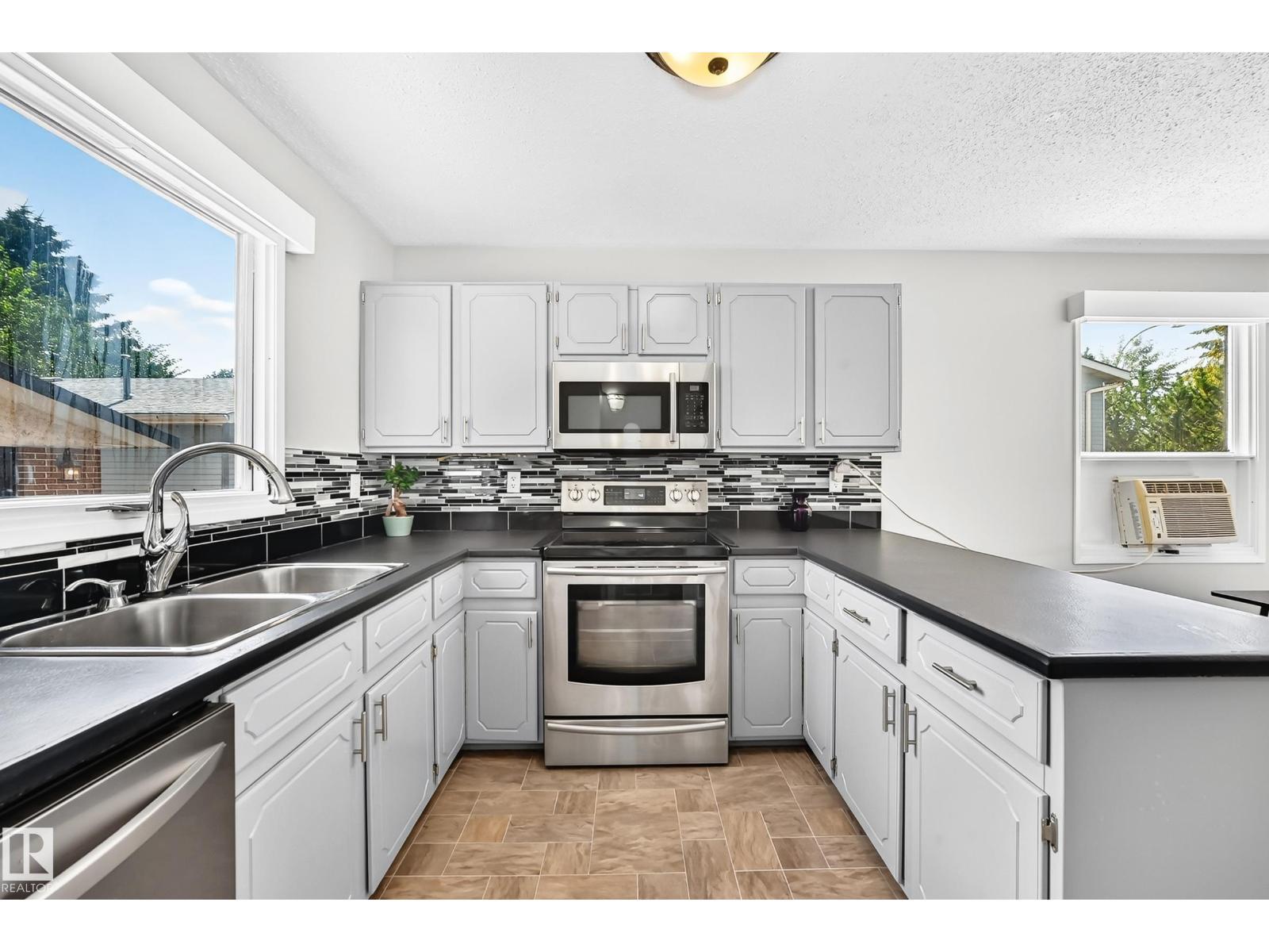 3615 10 Av Nw, Edmonton, AB - Indoor Photo Showing Kitchen With Double Sink