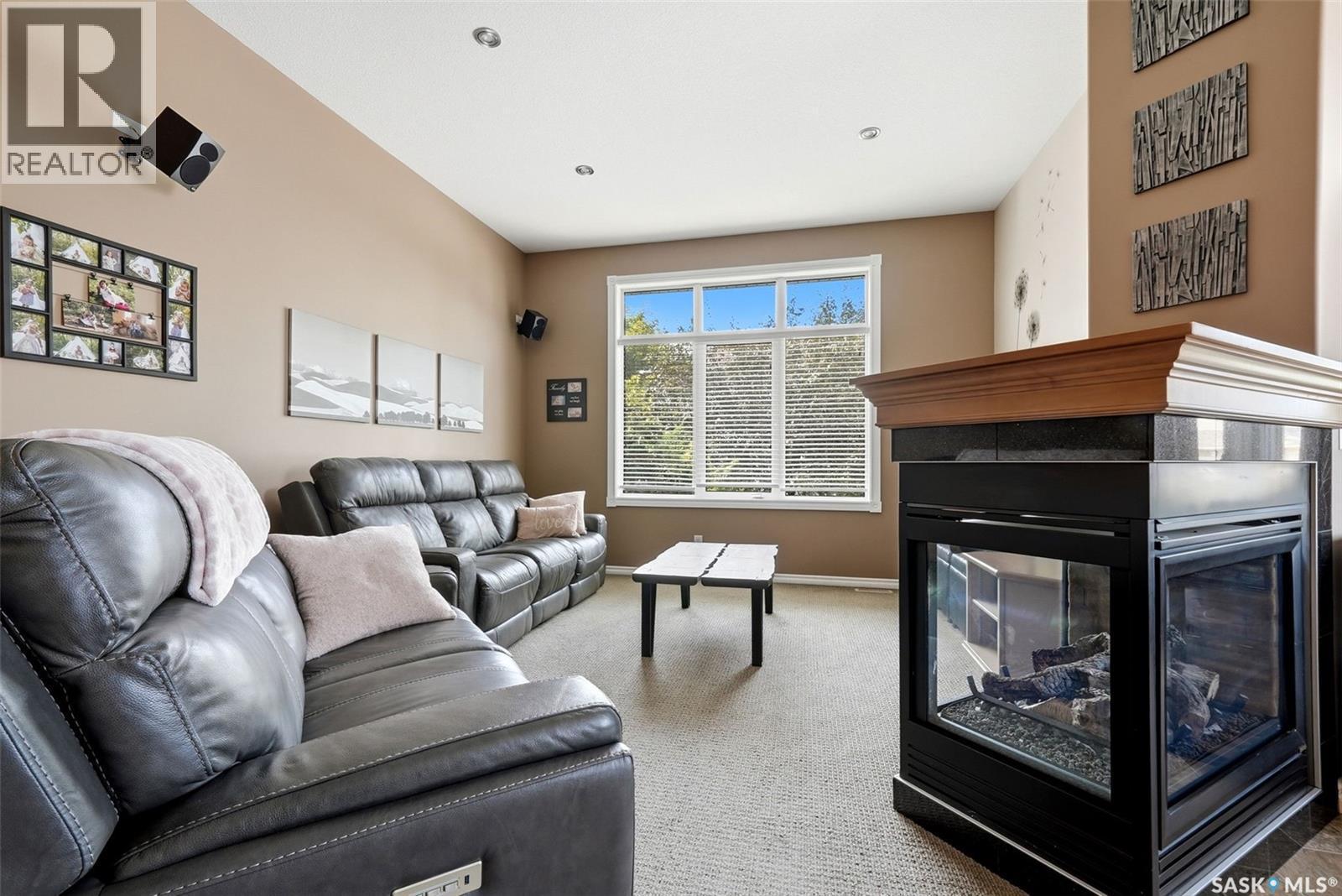54 Qu'Appelle Crescent, Balgonie, SK - Indoor Photo Showing Living Room With Fireplace