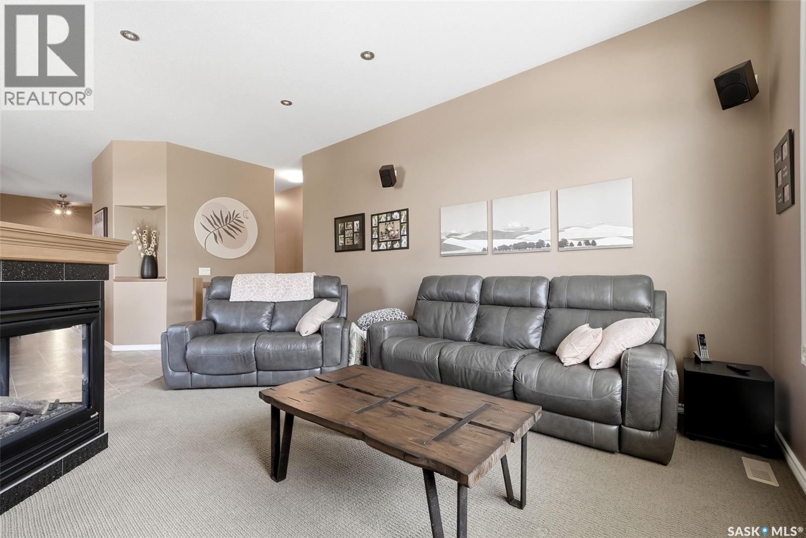 54 Qu'Appelle Crescent, Balgonie, SK - Indoor Photo Showing Living Room With Fireplace
