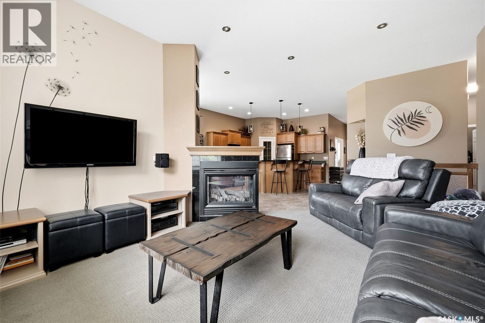 54 Qu'Appelle Crescent, Balgonie, SK - Indoor Photo Showing Living Room With Fireplace