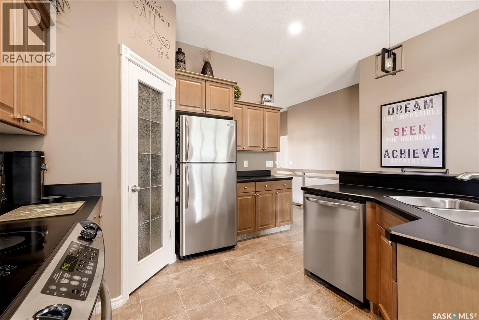 54 Qu'Appelle Crescent, Balgonie, SK - Indoor Photo Showing Kitchen With Double Sink