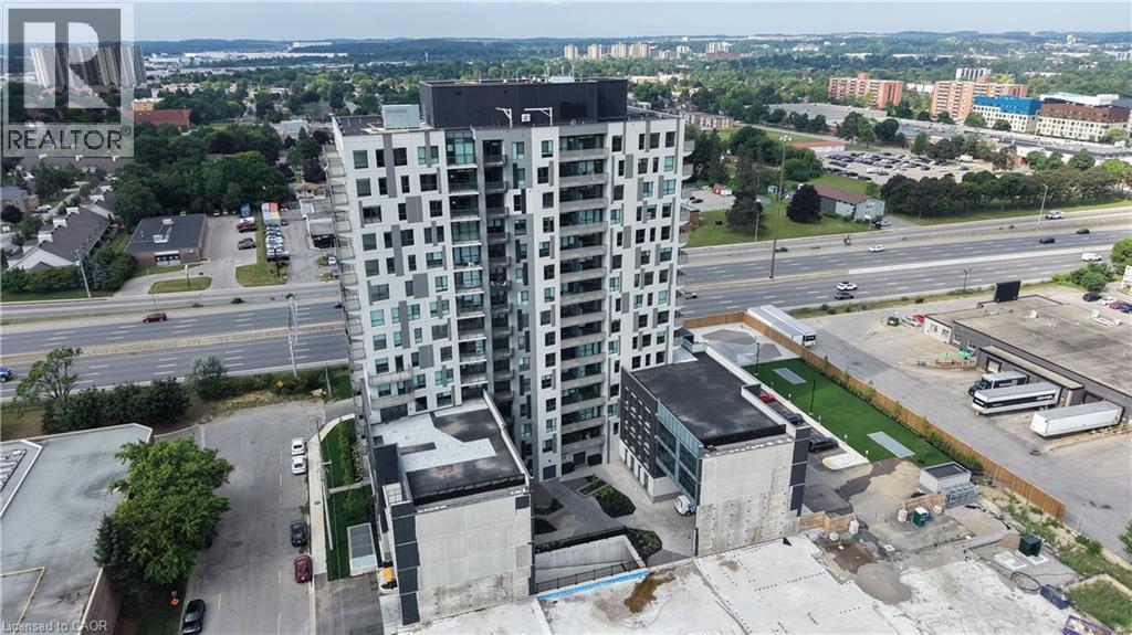 Contemporary high-rise building featuring a grey and white facade with extensive window detailing and individual balconies - 1333 Weber Street E Unit# 708, Kitchener, ON - Outdoor With View