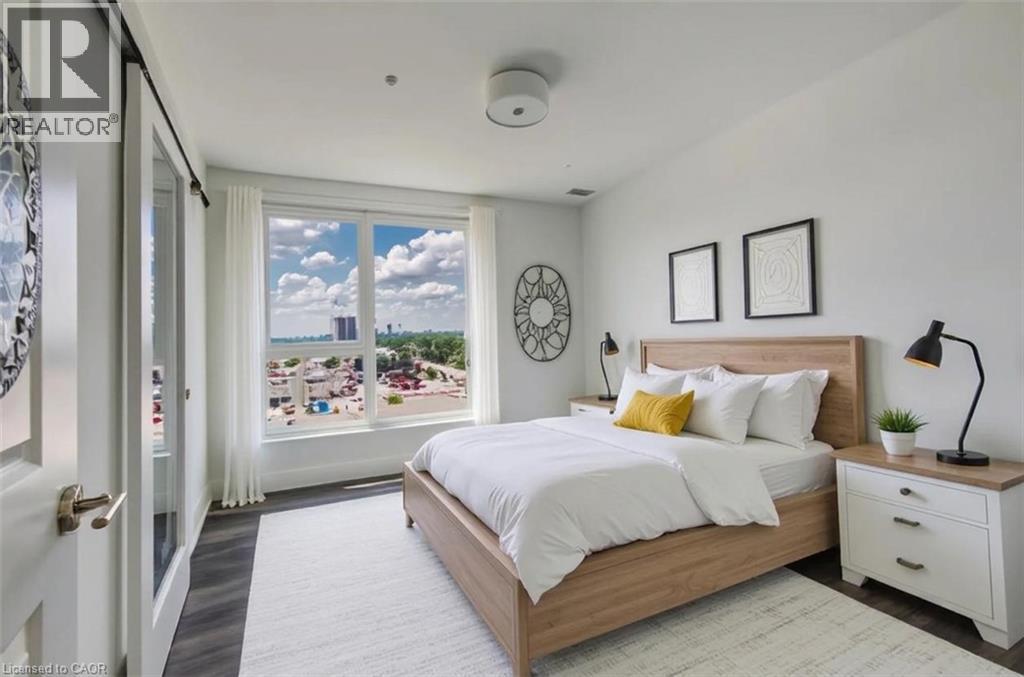 Expansive window featuring distant city and urban scenery - 1333 Weber Street E Unit# 708, Kitchener, ON - Indoor Photo Showing Bedroom