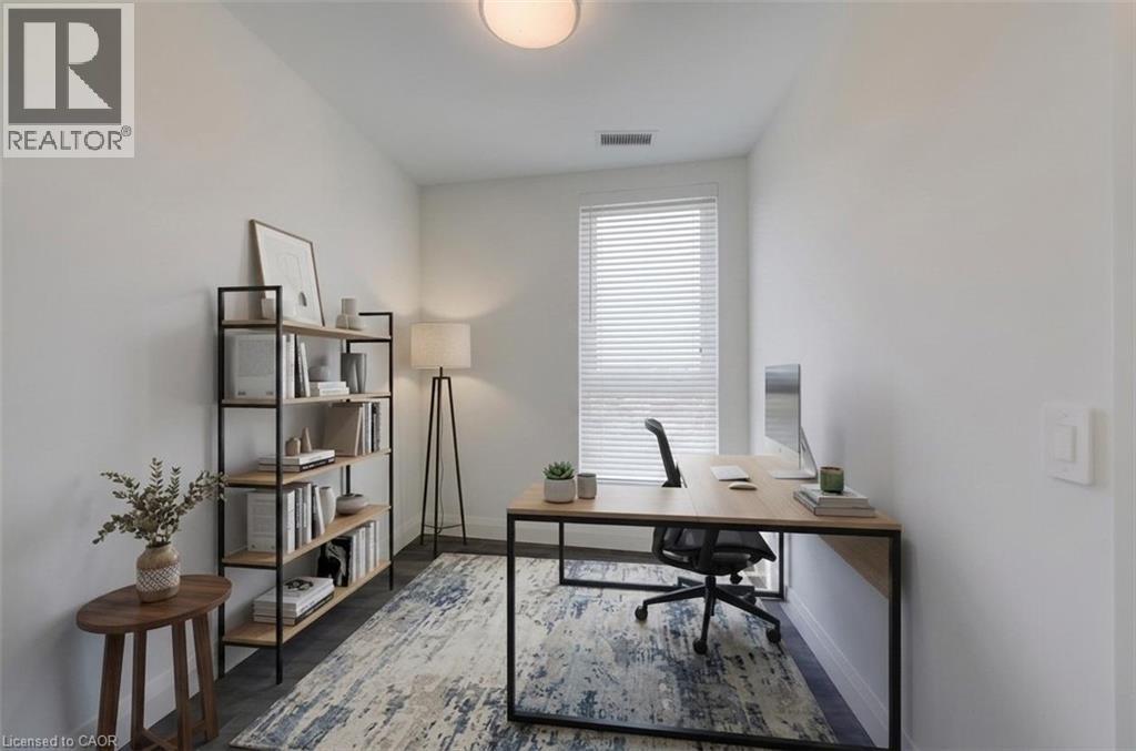 Bright room featuring a window with horizontal blinds, wood-finish flooring, and a ceiling-mounted light fixture - 1333 Weber Street E Unit# 708, Kitchener, ON - Indoor Photo Showing Office