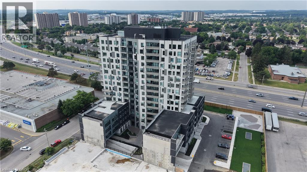 Contemporary high-rise building featuring a multi-story base with structured parking - 1333 Weber Street E Unit# 708, Kitchener, ON - Outdoor With View