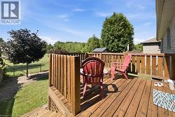 Expansive wood deck with vertical wood railings - 