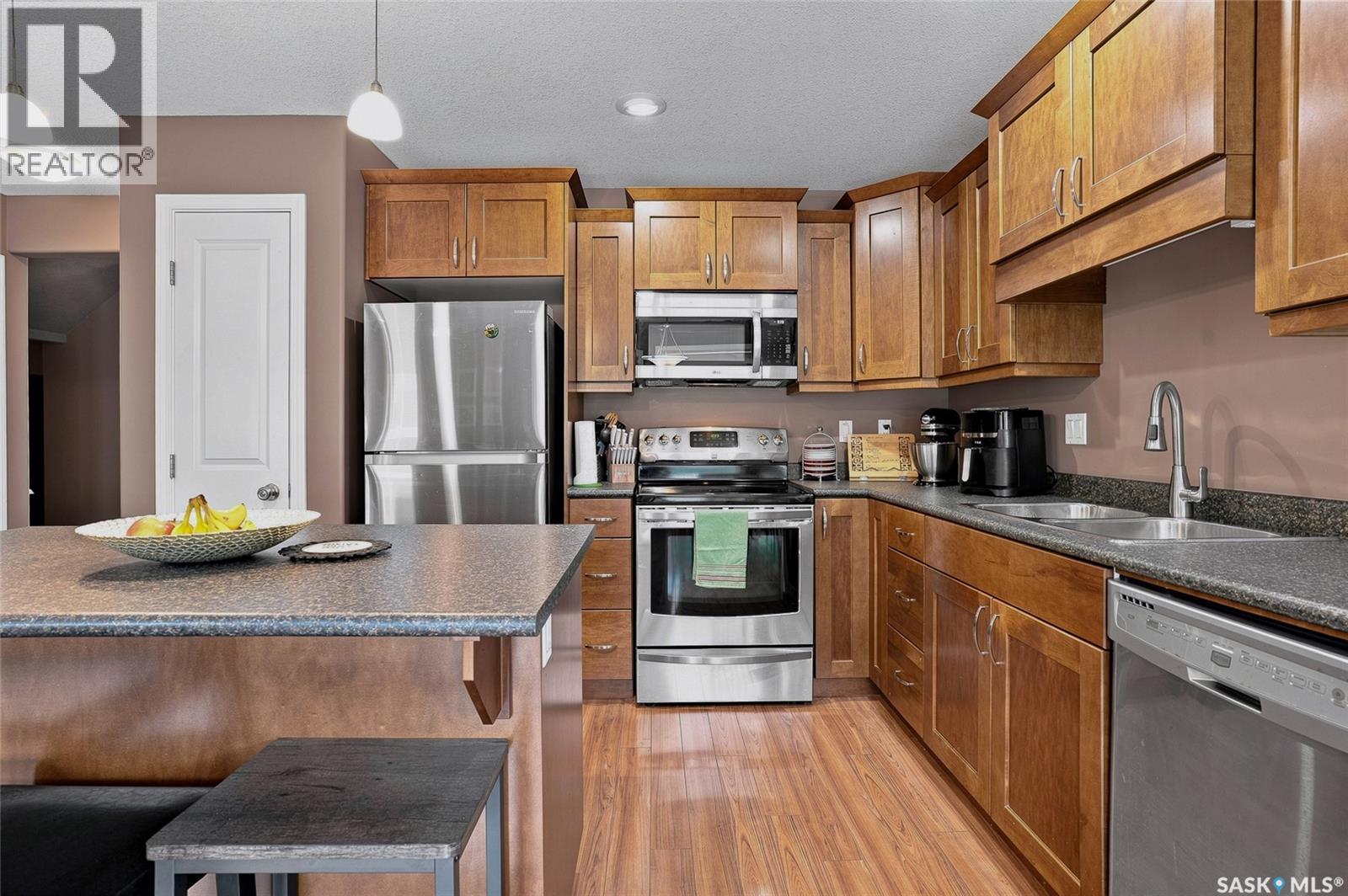 13 547 East Hampton Boulevard, Saskatoon, SK - Indoor Photo Showing Kitchen With Stainless Steel Kitchen With Double Sink
