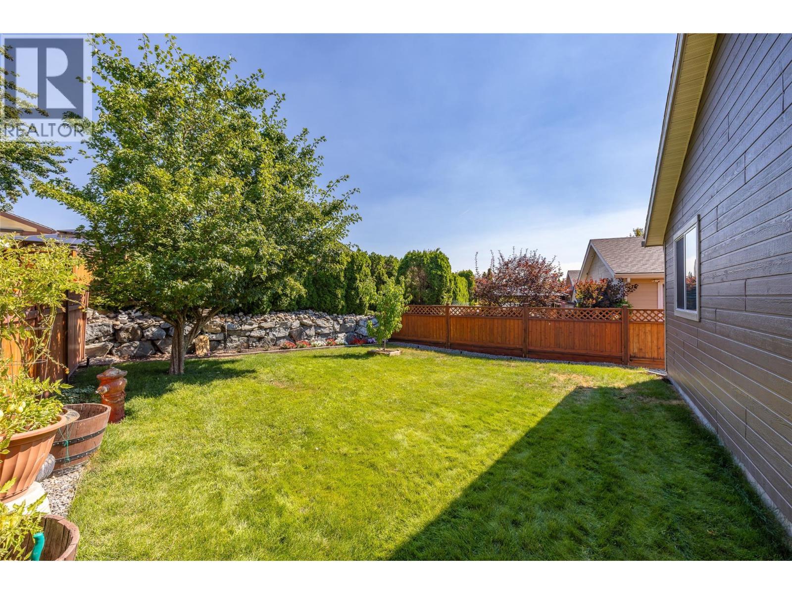 Large beautiful landscaped backyard fully fenced. - 2208 Mimosa Drive, West Kelowna, BC