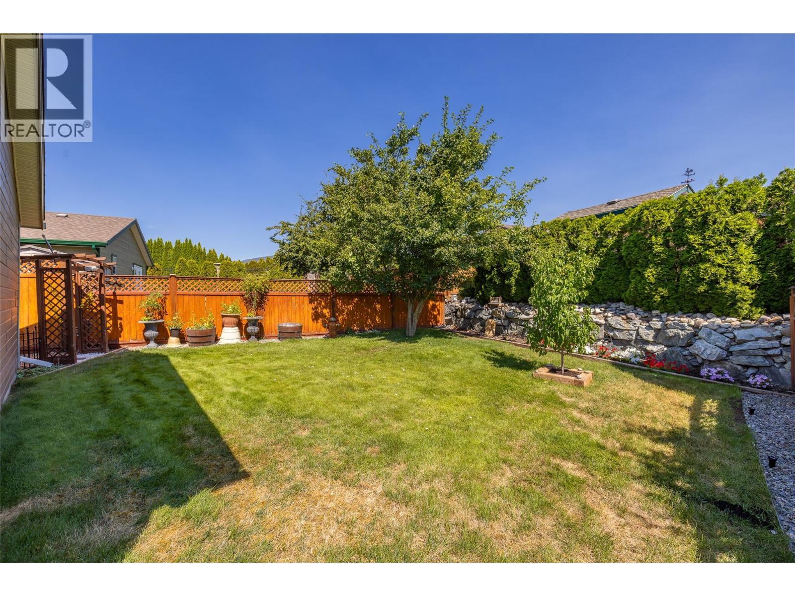 Large beautiful landscaped backyard fully fenced. - 2208 Mimosa Drive, West Kelowna, BC