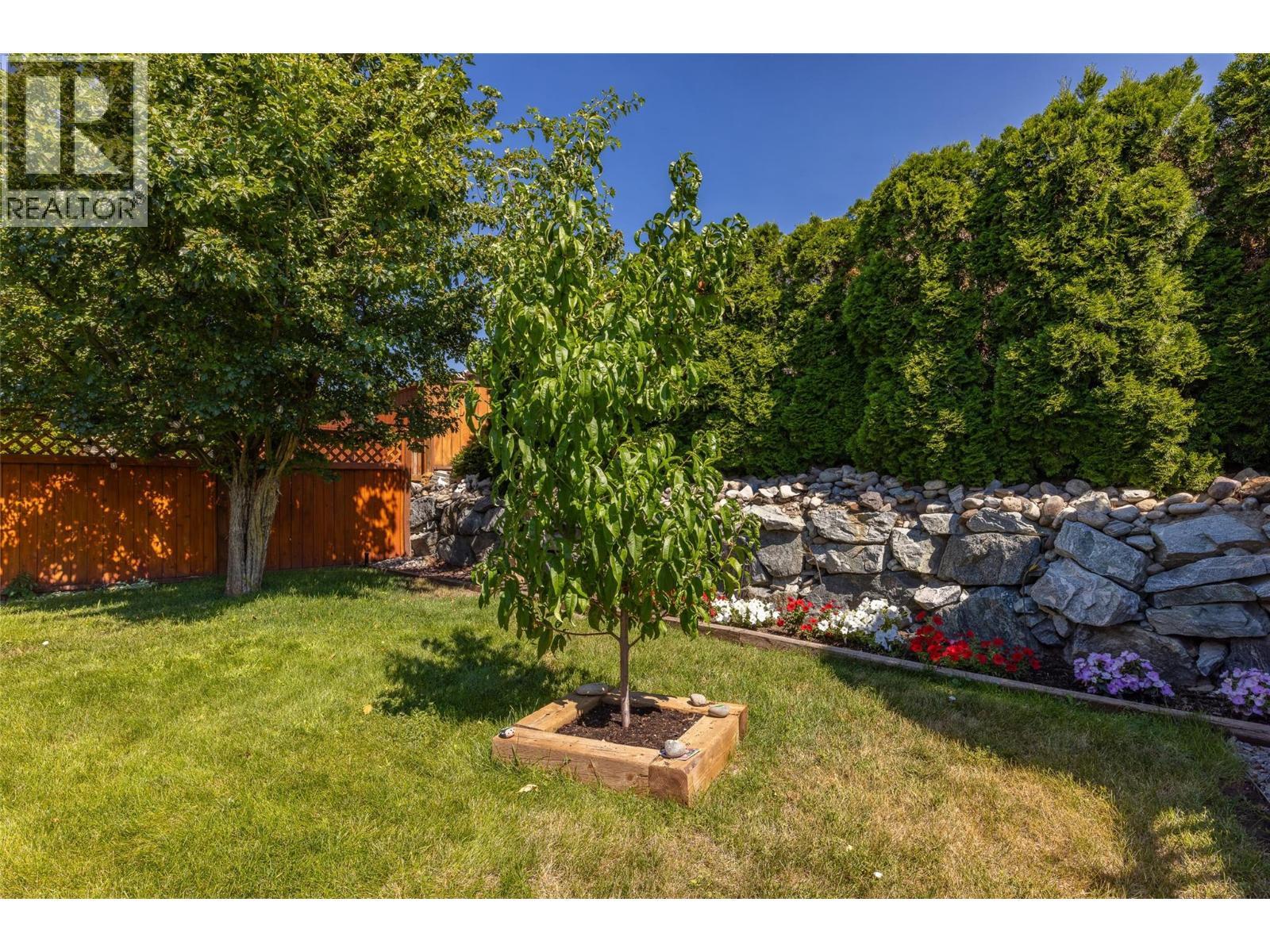 Large beautiful landscaped backyard fully fenced. - 2208 Mimosa Drive, West Kelowna, BC