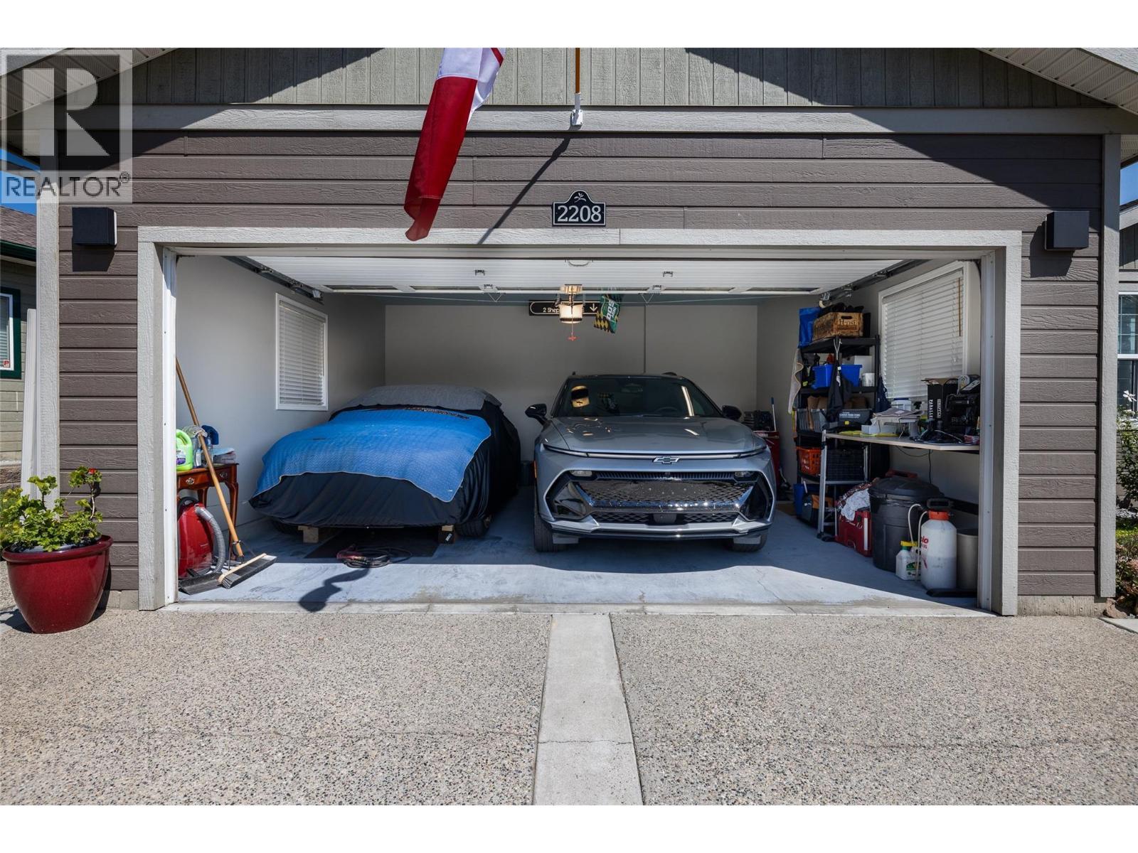 Large double car garage with EV hook up. Owner will be taking EV Charger - 2208 Mimosa Drive, West Kelowna, BC