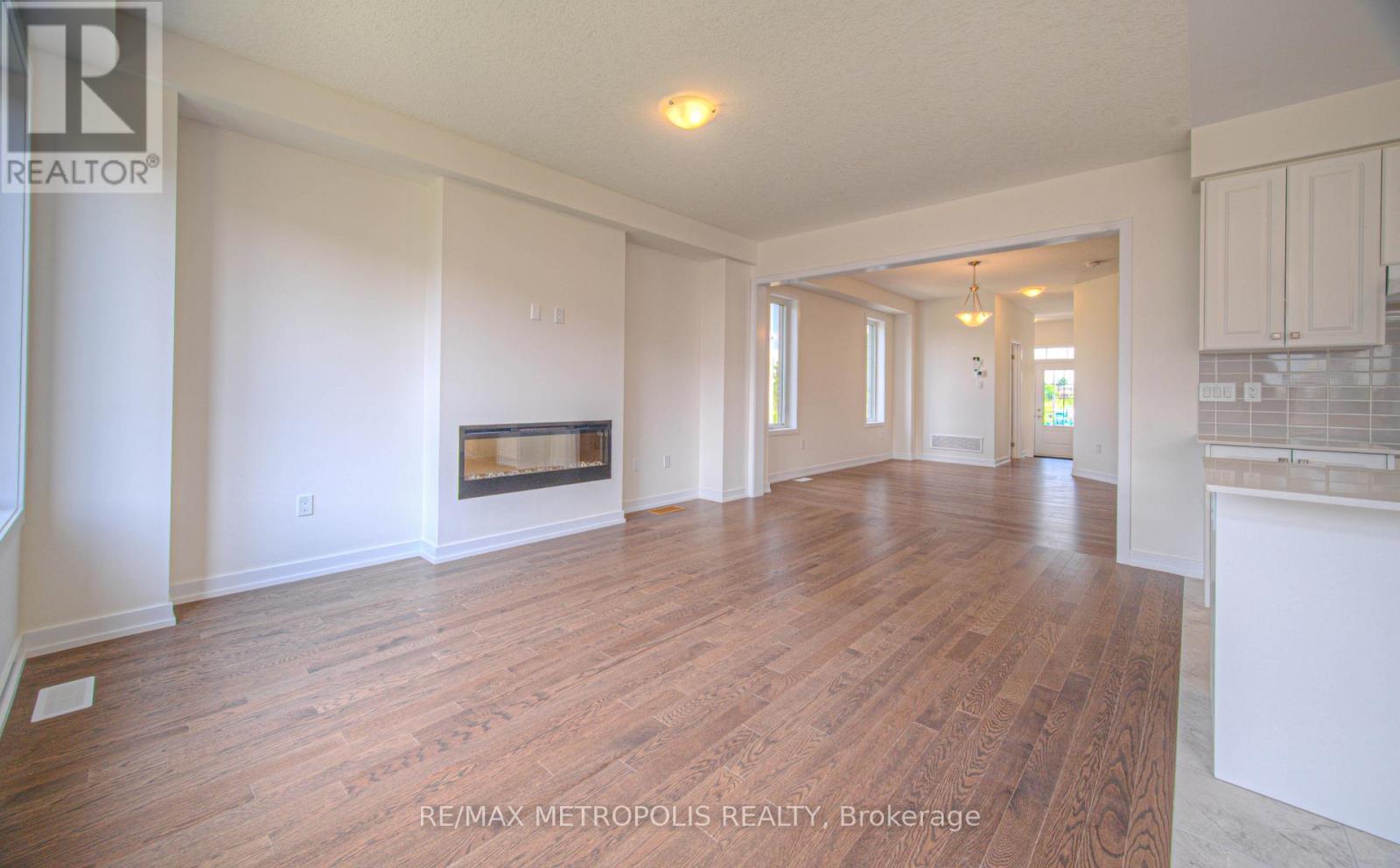 100 Moss Drive, Cambridge, ON - Indoor Photo Showing Other Room With Fireplace