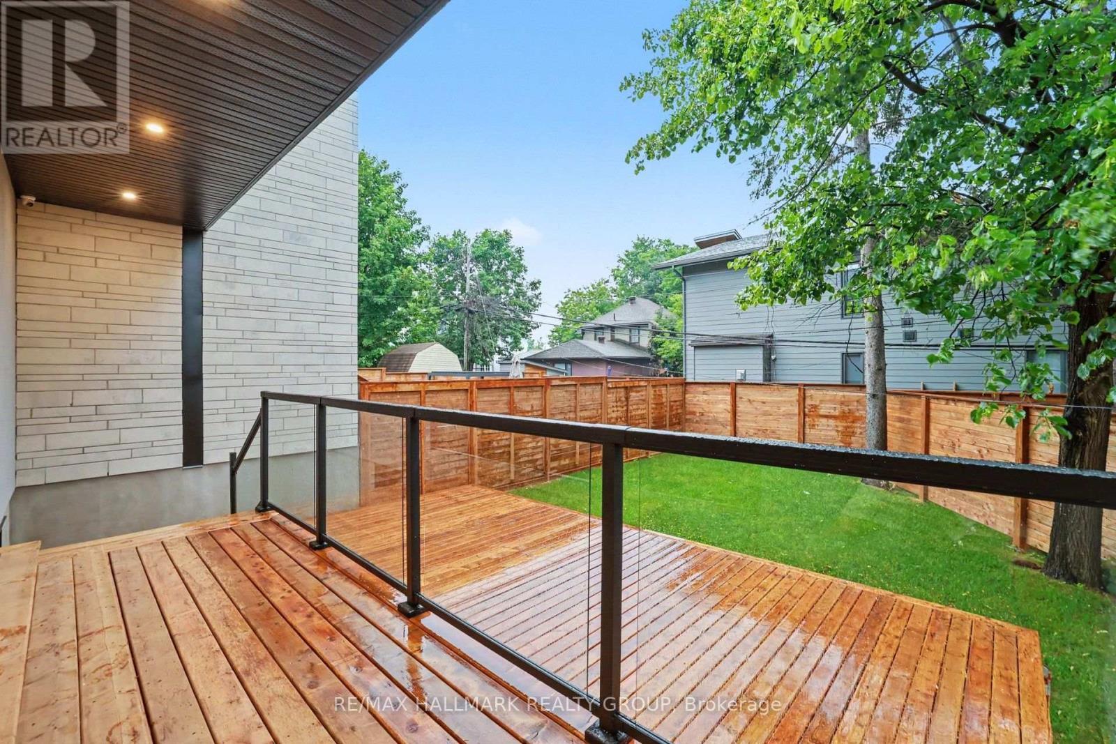 2 tier wood deck w/glass railing. BBQ gas hookup. - 218 Woodland Avenue, Ottawa, ON - Outdoor With Deck Patio Veranda With Exterior