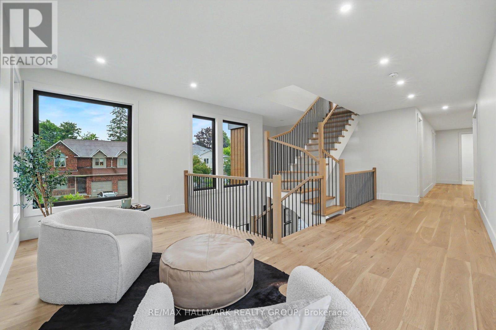 Wide hallways throughout. Stairs to rooftop deck. - 218 Woodland Avenue, Ottawa, ON - Indoor