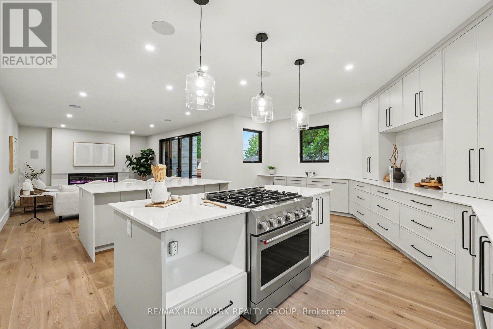 6 burner gas range with built-in hood fan. - 218 Woodland Avenue, Ottawa, ON - Indoor Photo Showing Kitchen With Upgraded Kitchen