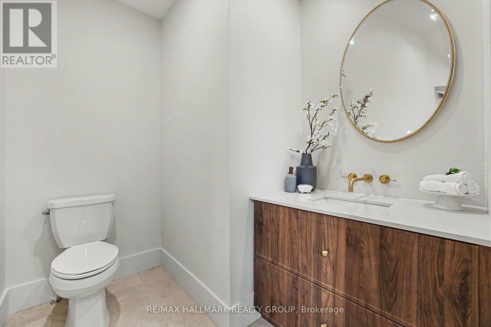 Elegant main floor powder room. - 218 Woodland Avenue, Ottawa, ON - Indoor Photo Showing Bathroom