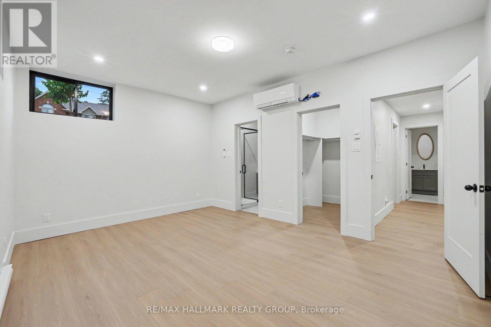 Primary bedrm in apt has a walk-in closet. - 218 Woodland Avenue, Ottawa, ON - Indoor Photo Showing Other Room
