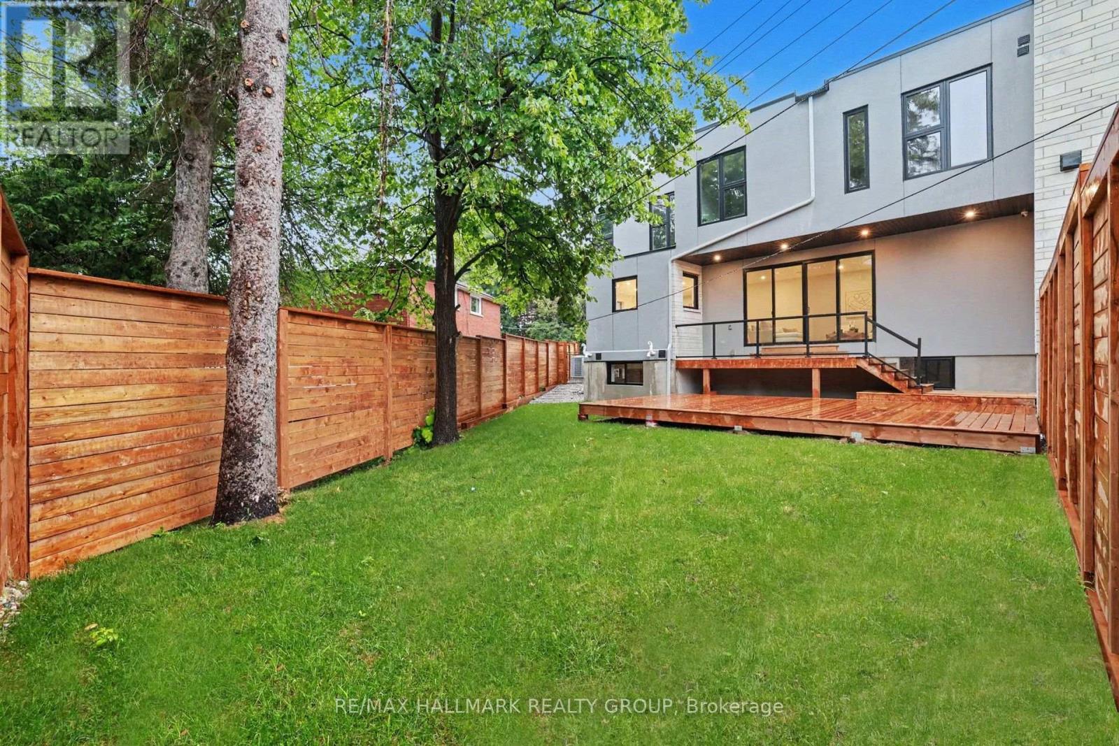 Make an appointment for a private viewing today. - 218 Woodland Avenue, Ottawa, ON - Outdoor With Deck Patio Veranda
