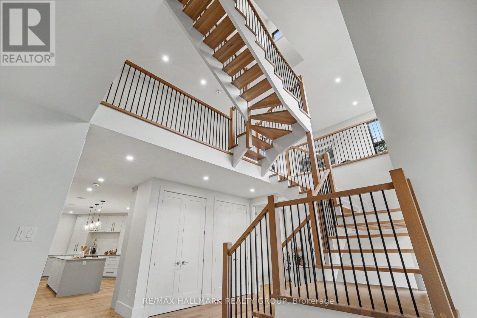 Stunning floating staircase. - 218 Woodland Avenue, Ottawa, ON - Indoor Photo Showing Other Room