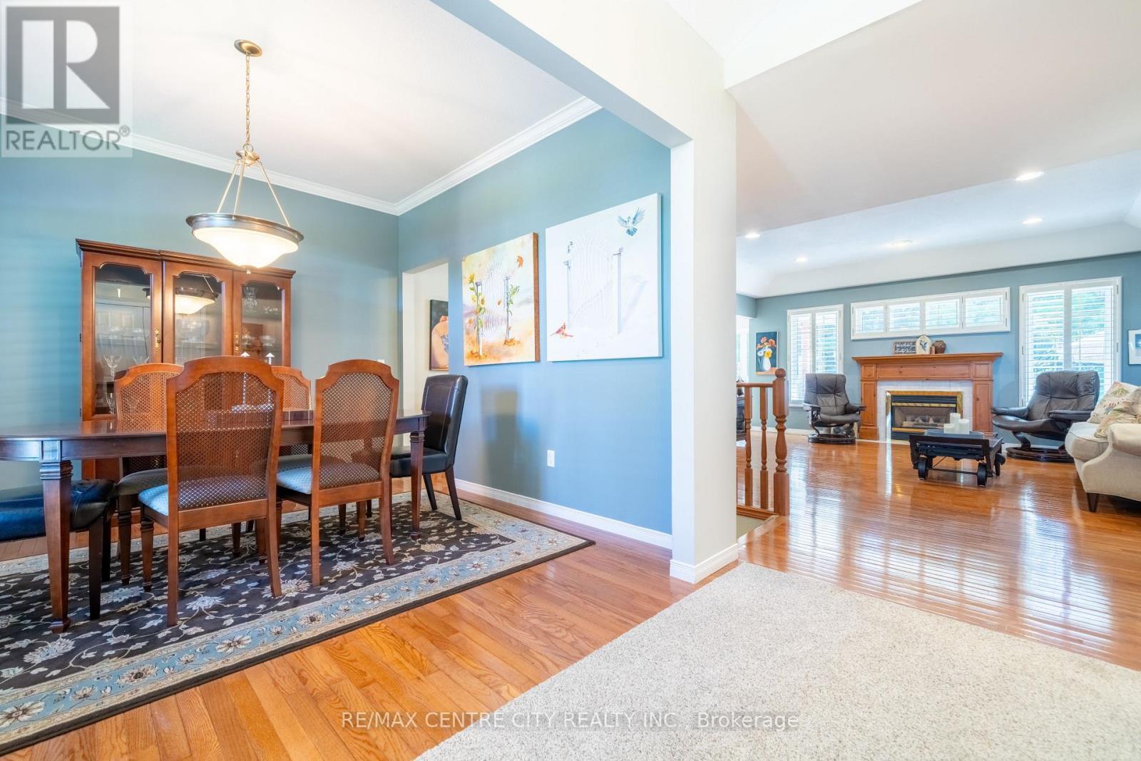 61 Aberdeen Drive, Middlesex Centre (Coldstream), ON - Indoor Photo Showing Dining Room With Fireplace