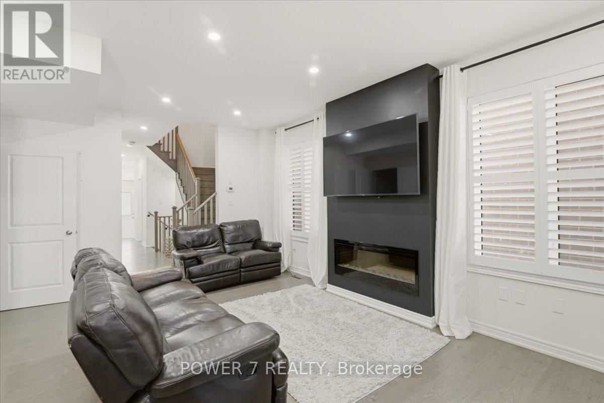 94 Conarty Crescent, Whitby, ON - Indoor Photo Showing Living Room With Fireplace