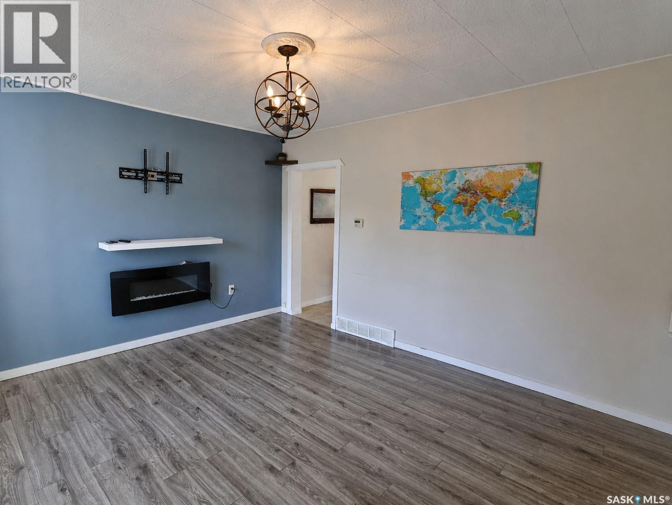 838 3Rd Street E, Prince Albert, SK - Indoor Photo Showing Living Room With Fireplace