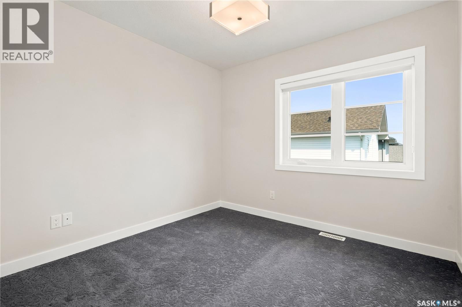 101 3229 Elgaard Drive, Regina, SK - Indoor Photo Showing Other Room