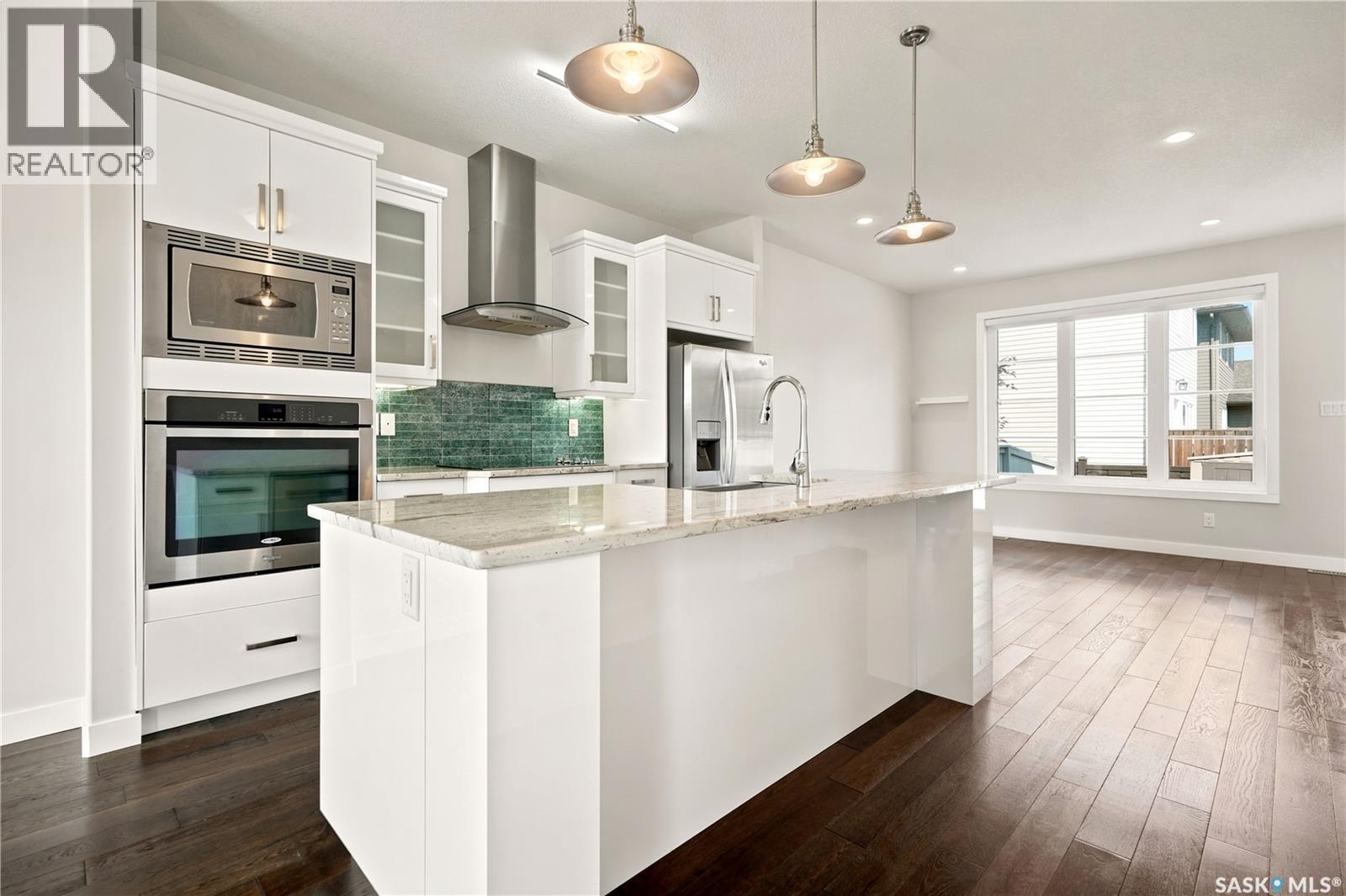 101 3229 Elgaard Drive, Regina, SK - Indoor Photo Showing Kitchen With Upgraded Kitchen