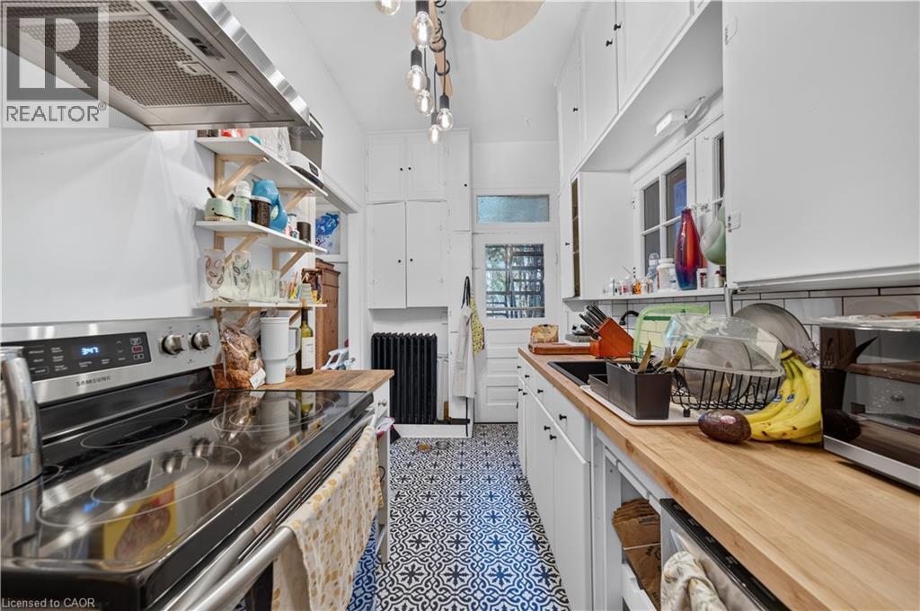 patterned tile flooring - 148 Markland Street, Hamilton, ON - Indoor Photo Showing Kitchen