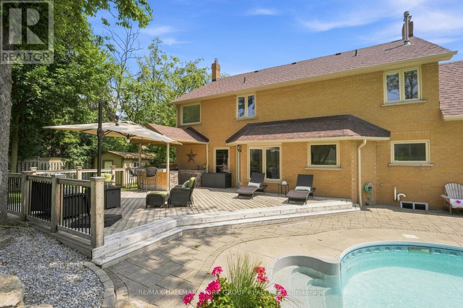 Large deck and outdoor kitchen - 111 Whispering Pine Trail, Aurora, ON - Outdoor With In Ground Pool
