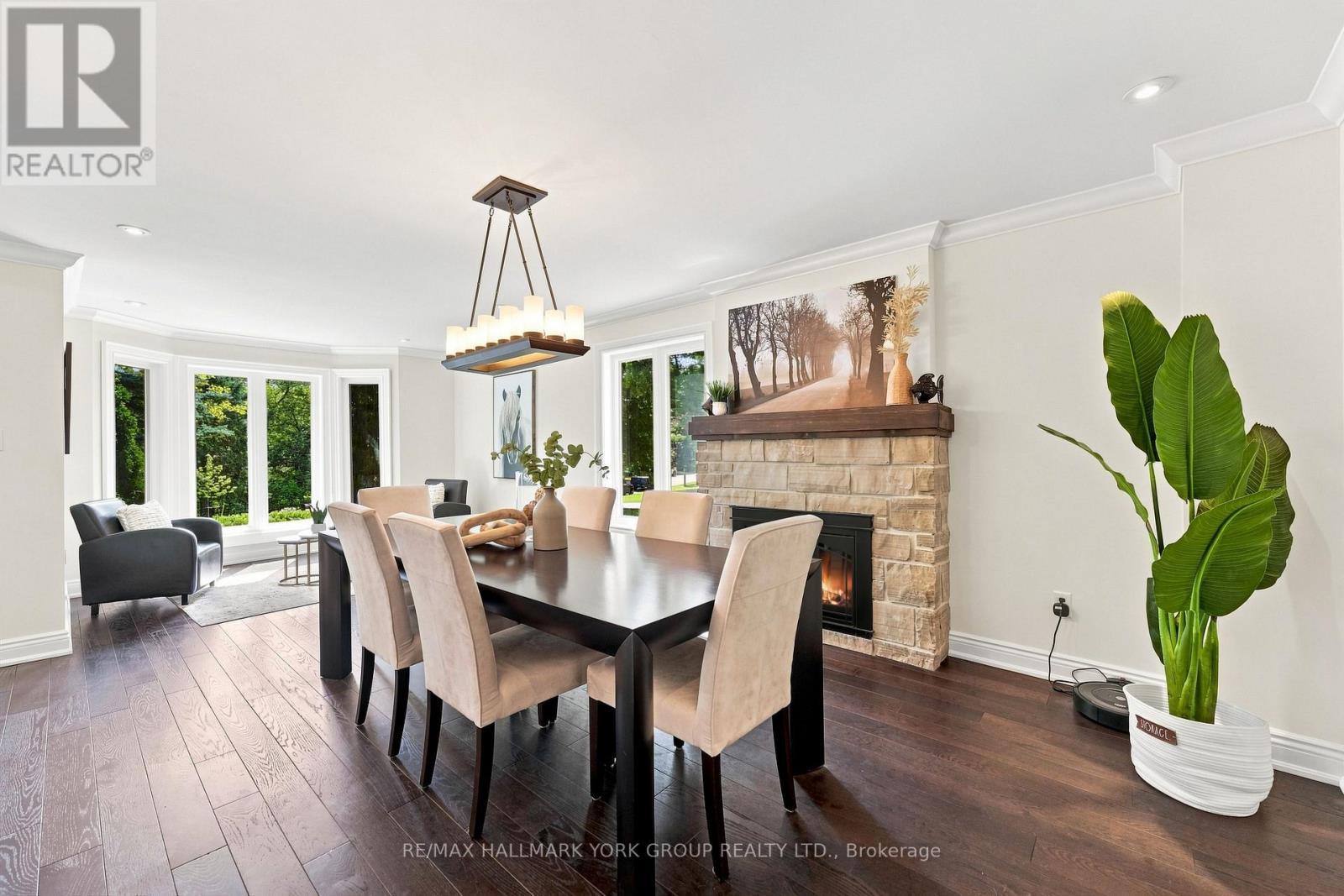 Stone Fireplace - 111 Whispering Pine Trail, Aurora, ON - Indoor Photo Showing Dining Room With Fireplace