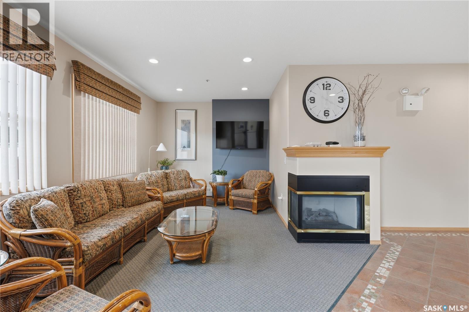 205 100 5Th Avenue, Regina Beach, SK - Indoor Photo Showing Living Room With Fireplace