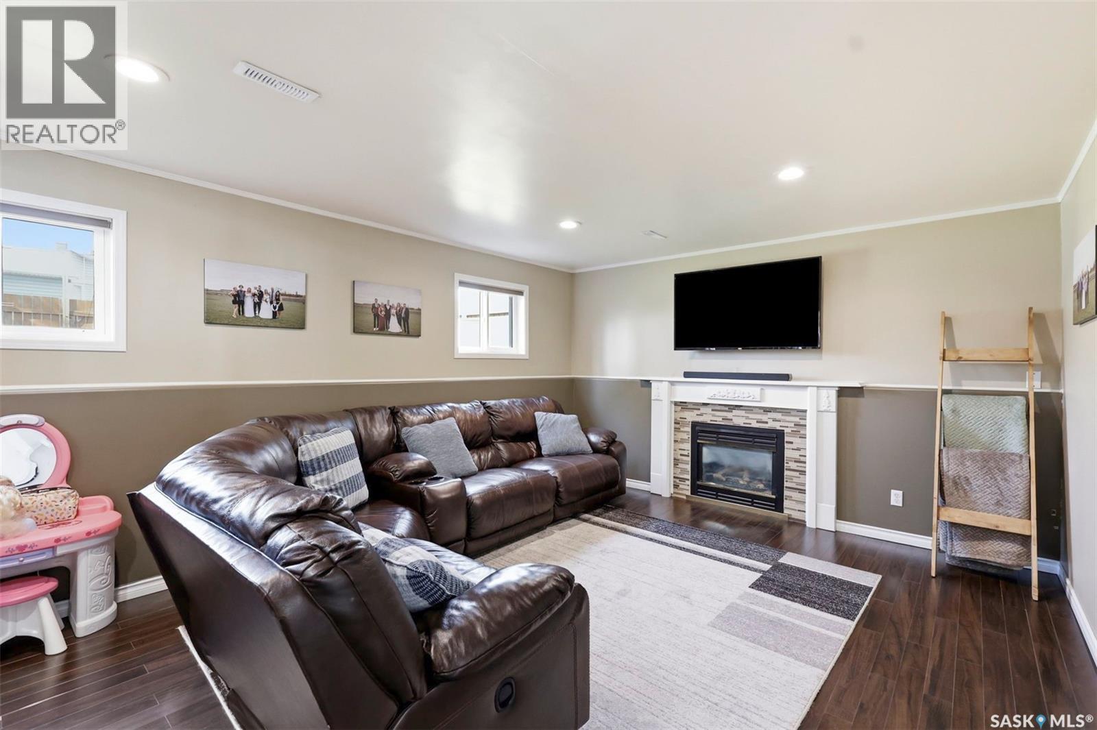201 1St Avenue N, Warman, SK - Indoor Photo Showing Living Room With Fireplace