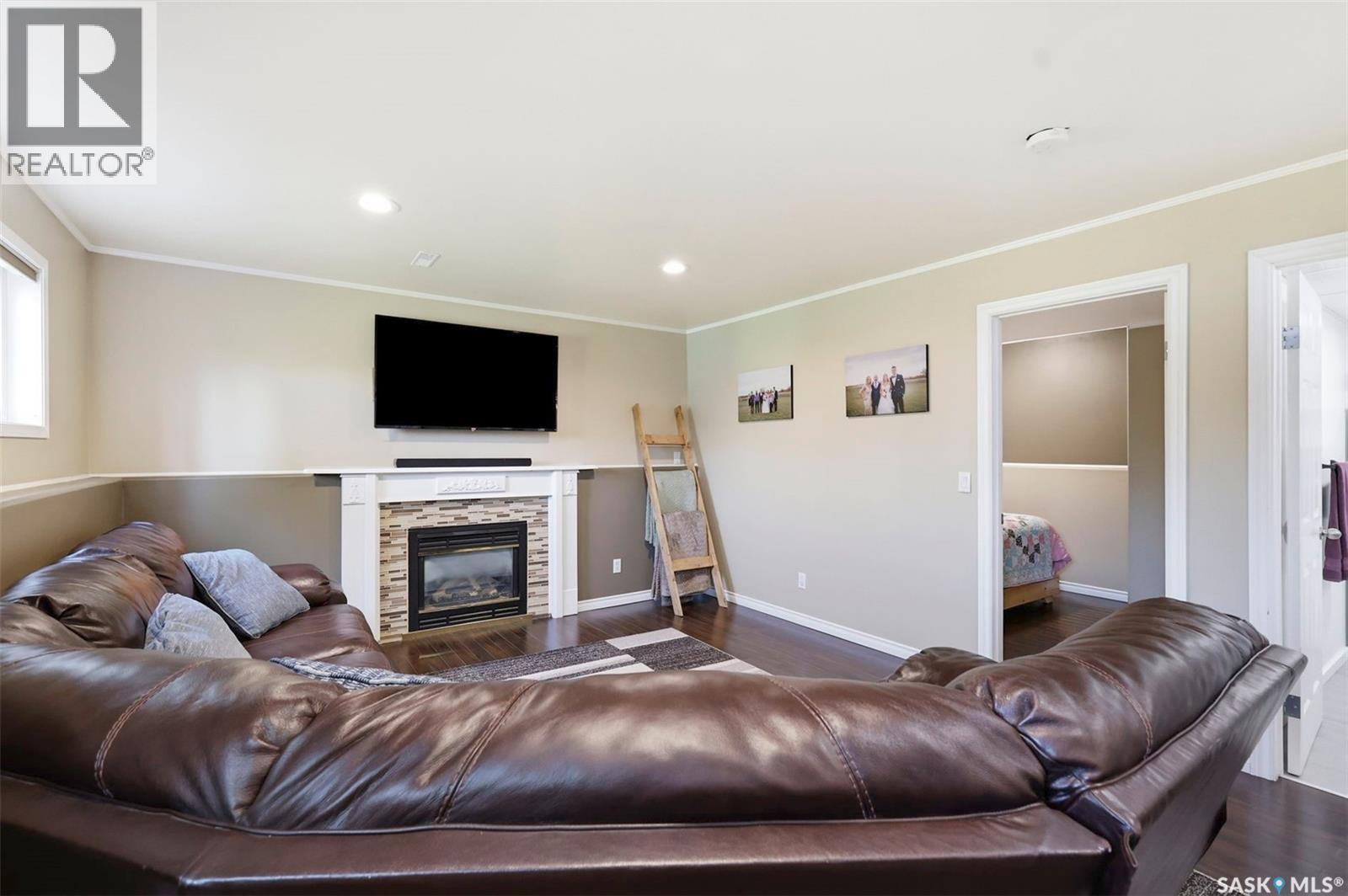 201 1St Avenue N, Warman, SK - Indoor Photo Showing Living Room With Fireplace