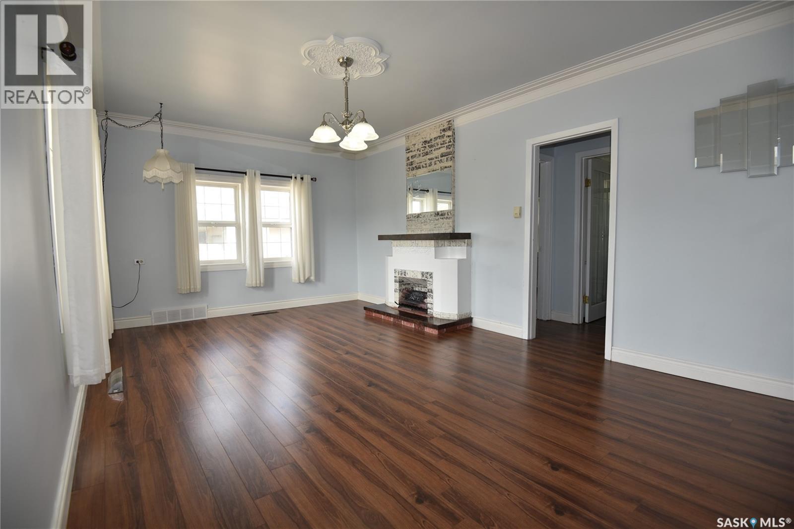 207 Pine Avenue, Nipawin, SK - Indoor Photo Showing Other Room With Fireplace