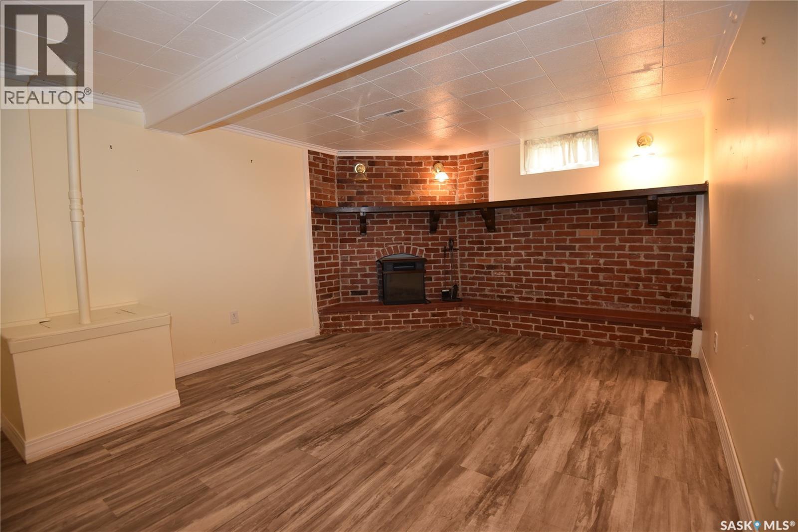 207 Pine Avenue, Nipawin, SK - Indoor Photo Showing Other Room With Fireplace