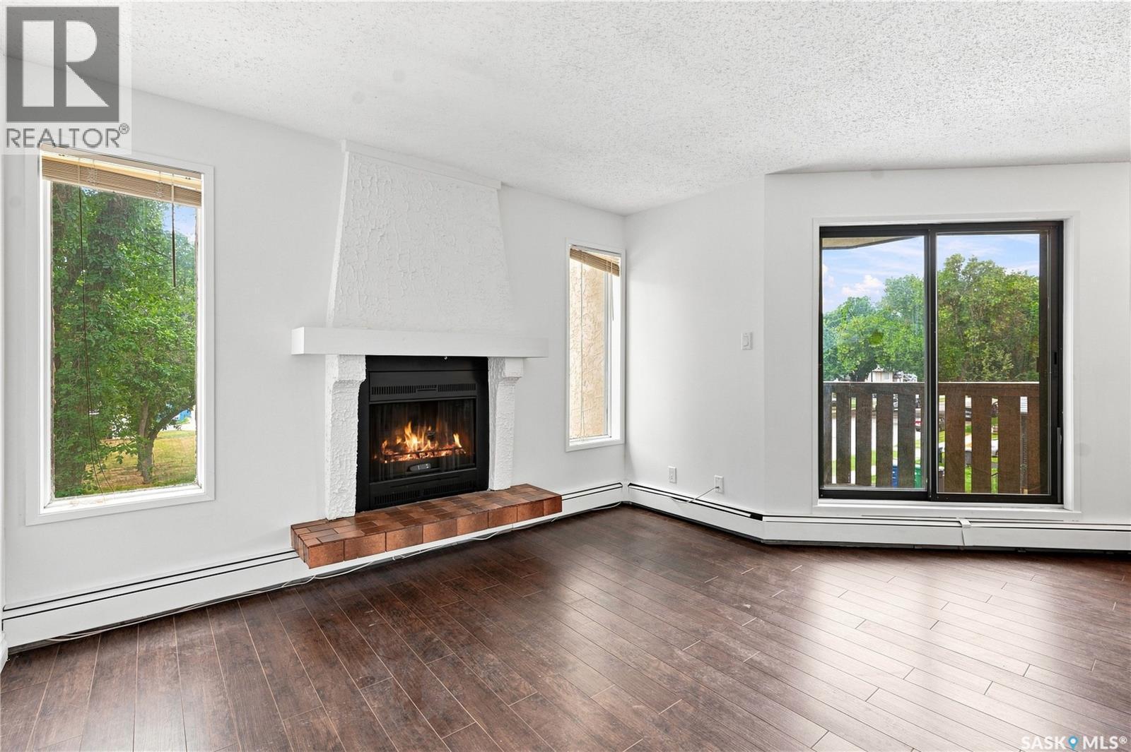 301 116 111Th Street, Saskatoon, SK - Indoor Photo Showing Living Room With Fireplace