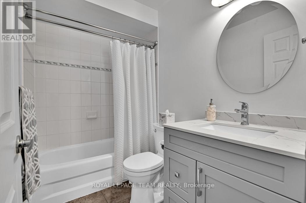 Main bath updated with new vanity & toilet - 4121 Wolfe Point Way, Ottawa, ON - Indoor Photo Showing Bathroom