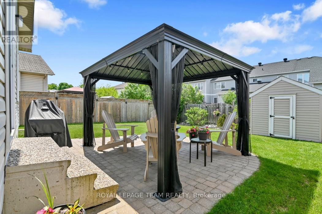 Lovely fenced yard w/ patio, gazebo & 8'x8' shed - 4121 Wolfe Point Way, Ottawa, ON - Outdoor With Deck Patio Veranda