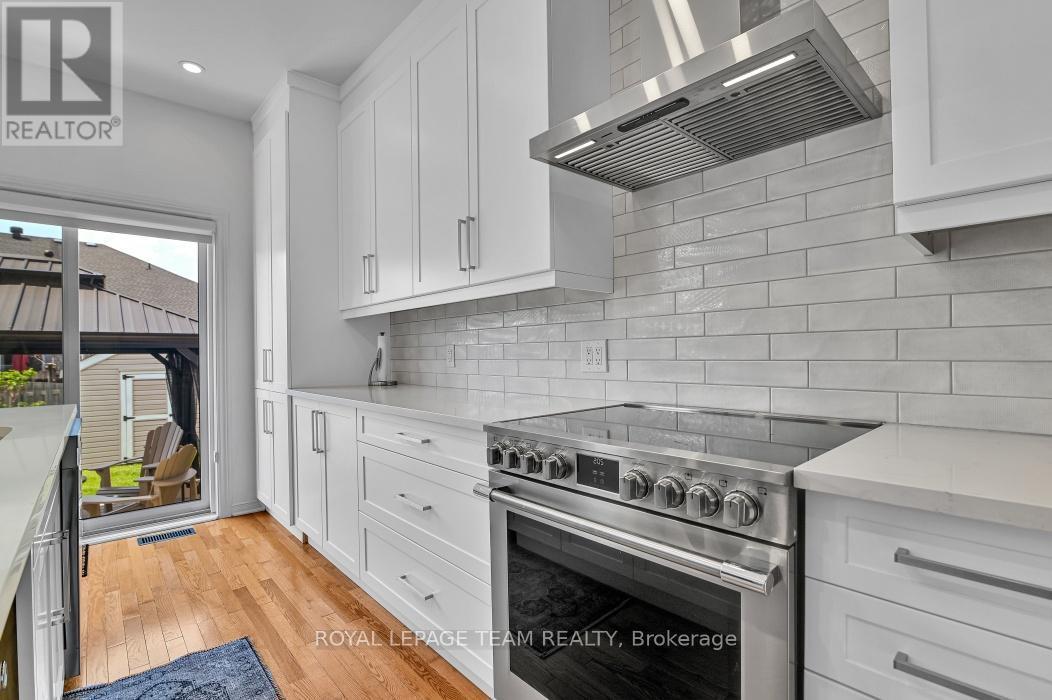High end Stainless appliances; designer backsplash - 4121 Wolfe Point Way, Ottawa, ON - Indoor Photo Showing Kitchen