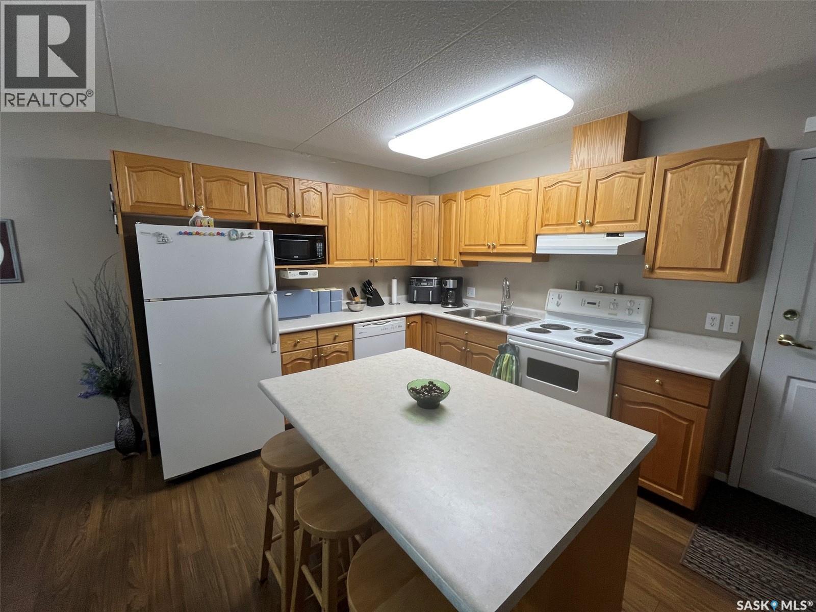 Unit306 1 26Th Street E, Prince Albert, SK - Indoor Photo Showing Kitchen With Double Sink