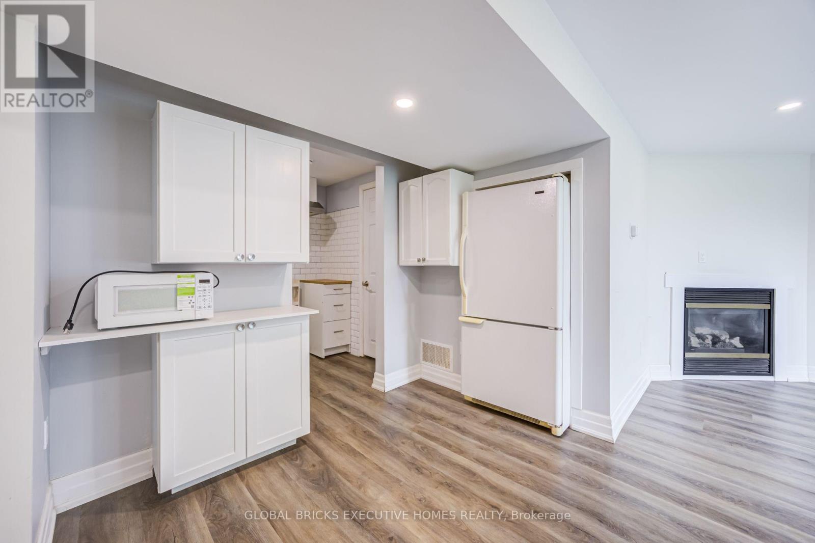 100 Lauris Avenue, Cambridge, ON - Indoor Photo Showing Kitchen With Fireplace