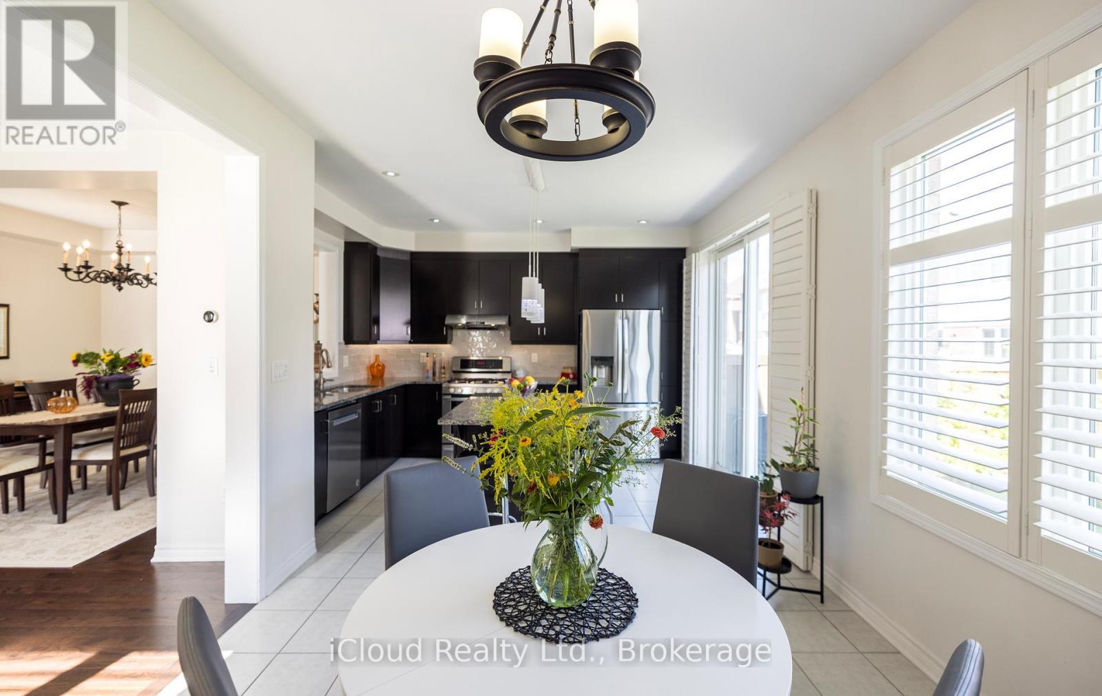 Eat-In Kitchen with W/O to Backyard - 954 Penson Crescent, Milton, ON - Indoor Photo Showing Dining Room