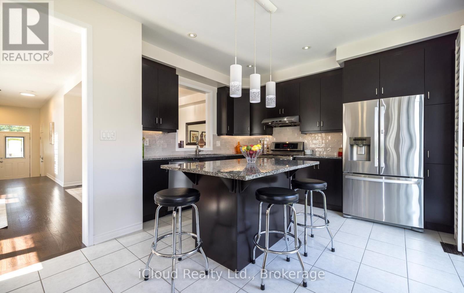 Kitchen Feature Breakfast Bar - 954 Penson Crescent, Milton, ON - Indoor Photo Showing Kitchen With Stainless Steel Kitchen With Upgraded Kitchen