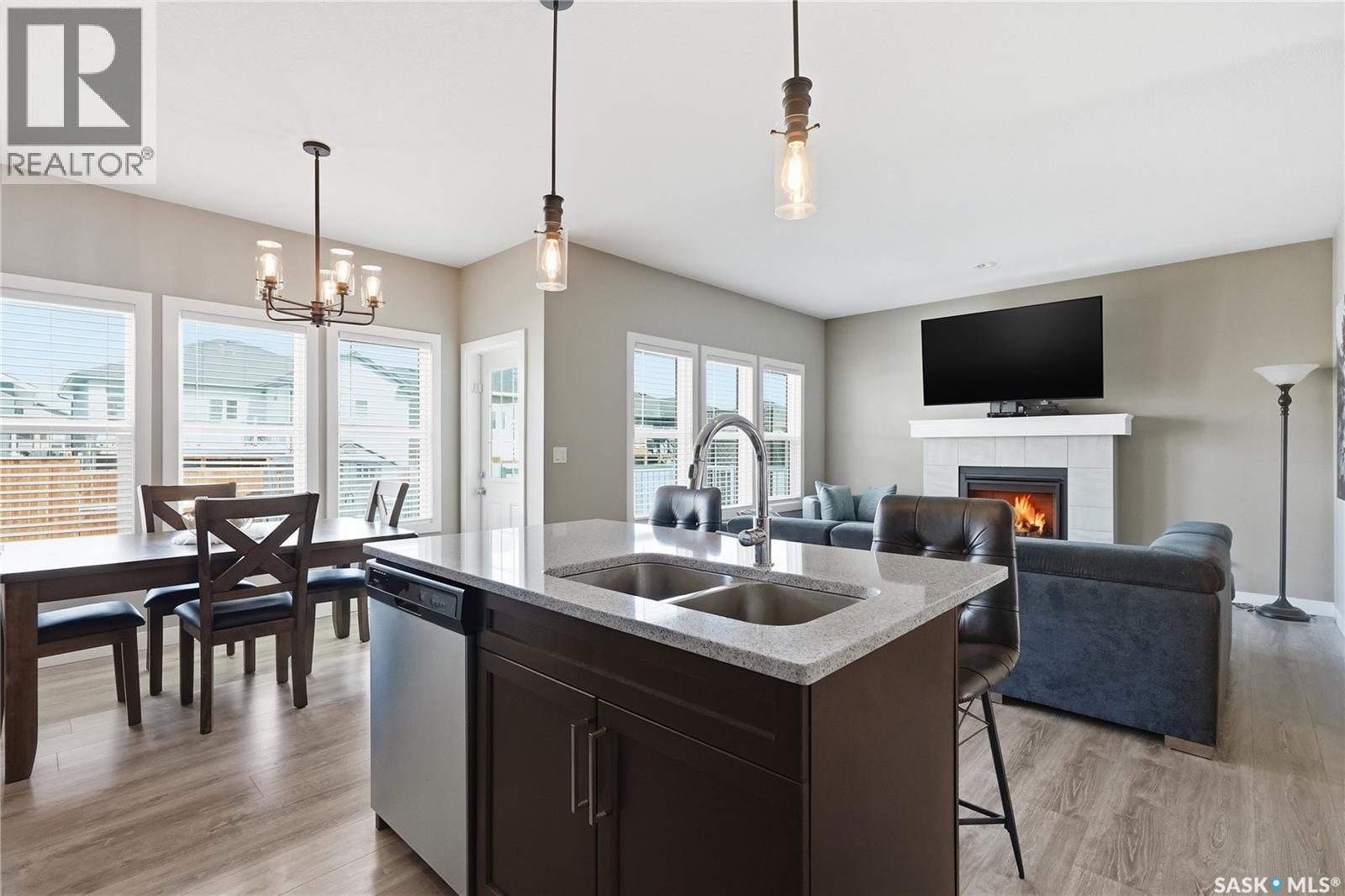 118 Stromberg Crescent, Saskatoon, SK - Indoor Photo Showing Other Room With Fireplace